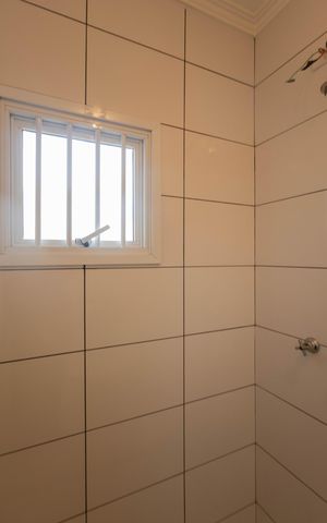 Casa à venda com 129m², 3 quartos e 2 vagas Casa à venda com 129m², 3 quartos e 2 vagasBanheiro da Suíte 3