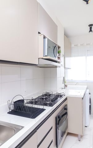 Apartamento à venda com 42m², 2 quartos e 1 vaga Apartamento à venda com 42m², 2 quartos e 1 vagaCozinha e Área de Serviço