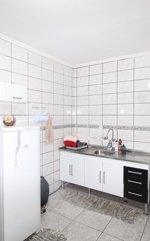 Casa para alugar com 50m², 2 quartos e 2 vagasCozinha