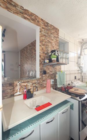 Apartamento à venda com 50m², 3 quartos e 1 vaga Apartamento à venda com 50m², 3 quartos e 1 vagaCozinha e Área de Serviço
