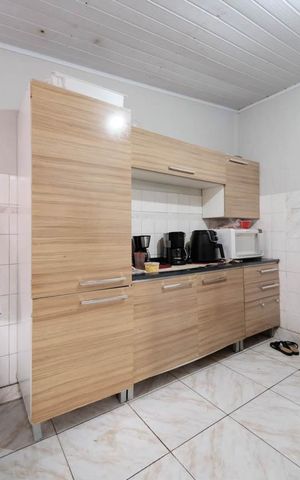 Casa à venda com 80m², 2 quartos e 2 vagasSala/Cozinha