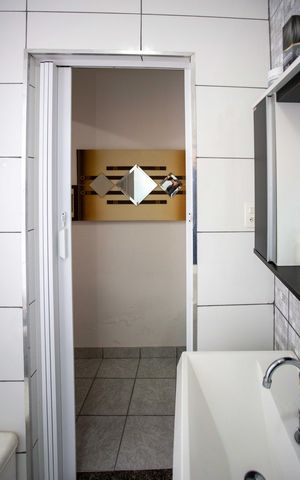 Casa à venda com 125m², 4 quartos e 2 vagasBanheiro Casa 1