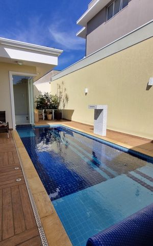 Casa de condomínio à venda com 415m², 4 quartos e 3 vagas Casa de condomínio à venda com 415m², 4 quartos e 3 vagasÁrea externa
