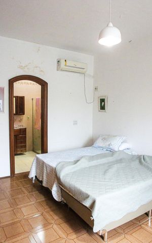 Casa à venda com 435m², 6 quartos e 4 vagasQuarto Suíte 1