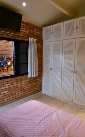 Casa de condomínio para alugar com 238m², 3 quartos e 4 vagasQuarto 2 - Suíte