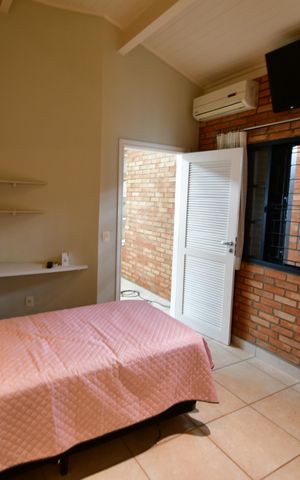 Casa de condomínio para alugar com 238m², 3 quartos e 4 vagasQuarto 2 - Suíte