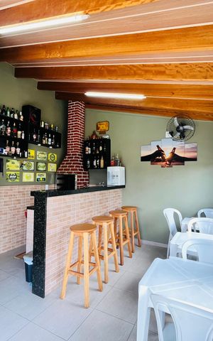 Casa à venda com 165m², 2 quartos e 2 vagas Casa à venda com 165m², 2 quartos e 2 vagasÁrea externa