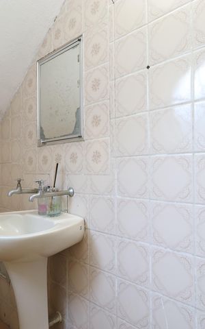 Casa à venda com 450m², 4 quartos e 3 vagasBanheiro da Suíte 2