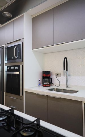 Casa de condomínio à venda com 134m², 3 quartos e 2 vagasCozinha e Área de Serviço