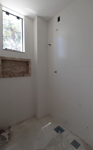 Casa à venda com 122m², 3 quartos e 4 vagasBanheiro da Suite