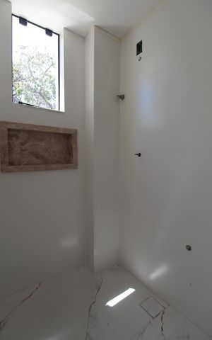 Casa à venda com 122m², 3 quartos e 4 vagasBanheiro da Suite
