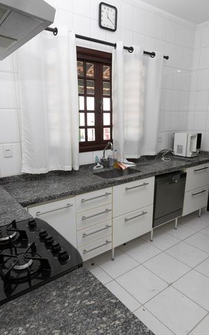 Casa de condomínio para alugar com 140m², 3 quartos e 4 vagasCOZINHA