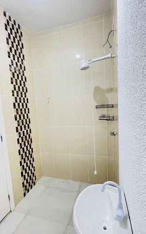 Casa de condomínio para alugar com 70m², 2 quartos e 3 vagasBanheiro da suíte