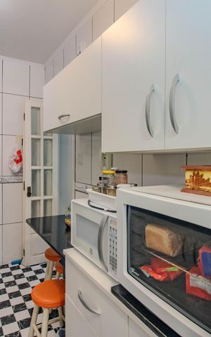 Apartamento à venda com 57m², 2 quartos e sem vaga Apartamento à venda com 57m², 2 quartos e sem vagaCozinha e Área de Serviço