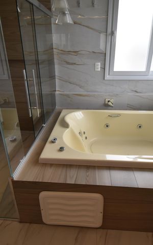 Casa de condomínio para alugar com 411m², 4 quartos e 3 vagasBanheiro Suíte 1