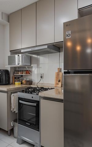 Apartamento à venda com 40m², 2 quartos e 1 vaga Apartamento à venda com 40m², 2 quartos e 1 vagaCozinha e Área de Serviço