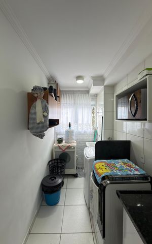 Apartamento à venda com 50m², 2 quartos e 1 vaga Apartamento à venda com 50m², 2 quartos e 1 vagaCozinha e Área de Serviço