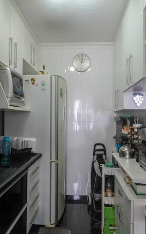 Apartamento à venda com 49m², 2 quartos e 1 vaga Apartamento à venda com 49m², 2 quartos e 1 vagaCozinha e Área de Serviço