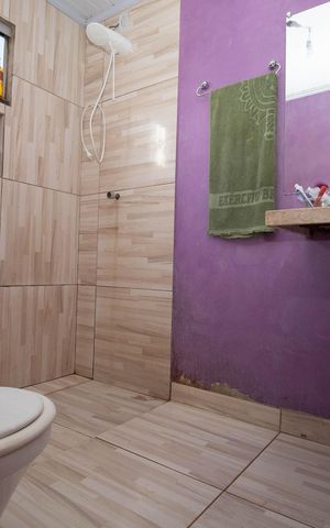 Casa à venda com 70m², 3 quartos e 2 vagas Casa à venda com 70m², 3 quartos e 2 vagasBanheiro da Suíte 1