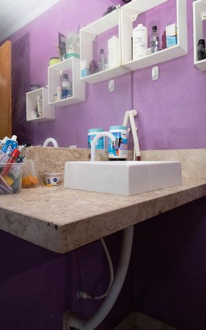 Casa à venda com 70m², 3 quartos e 2 vagas Casa à venda com 70m², 3 quartos e 2 vagasBanheiro da Suíte 1
