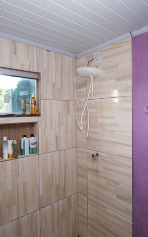 Casa à venda com 70m², 3 quartos e 2 vagas Casa à venda com 70m², 3 quartos e 2 vagasBanheiro da Suíte 1