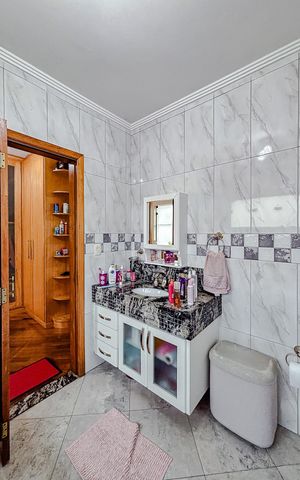 Casa para alugar com 379m², 5 quartos e 7 vagasBanheiro da Suíte 4