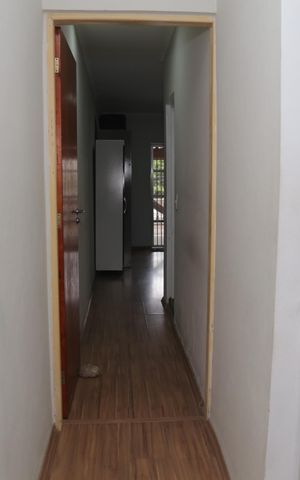 Casa à venda com 159m², 3 quartos e 2 vagas Casa à venda com 159m², 3 quartos e 2 vagasCorredor entre os quartos