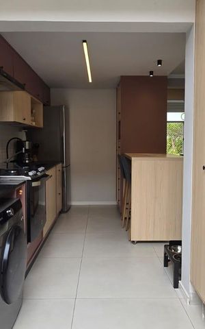 Casa de condomínio à venda com 98m², 3 quartos e 2 vagas Casa de condomínio à venda com 98m², 3 quartos e 2 vagasCozinha e Área de Serviço