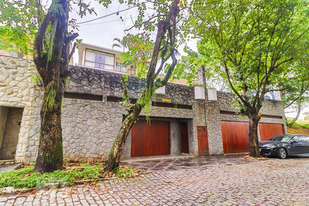 Casa de condomínio à venda com 800m², 5 quartos e 5 vagasFachada e Garagens