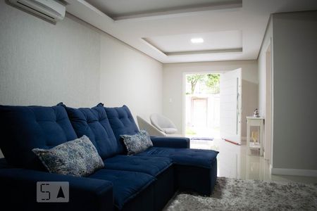 Sala de Estar de casa de condomínio à venda com 4 quartos, 213m² em Vila Nova, Porto Alegre