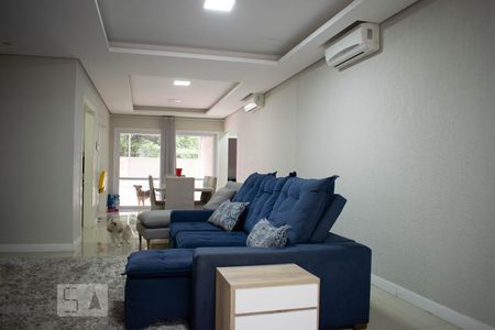 Sala de Estar de casa de condomínio à venda com 4 quartos, 213m² em Vila Nova, Porto Alegre