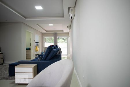 Sala de Estar de casa de condomínio à venda com 4 quartos, 213m² em Vila Nova, Porto Alegre