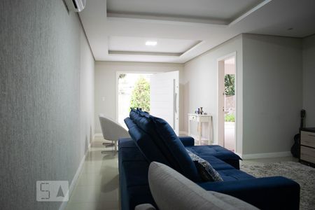 Sala de Estar de casa de condomínio à venda com 4 quartos, 213m² em Vila Nova, Porto Alegre