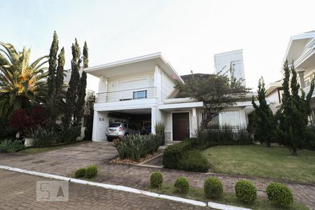 Casa de condomínio à venda com 320m², 4 quartos e 4 vagas Casa de condomínio à venda com 320m², 4 quartos e 4 vagasFachada