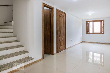 Sala de casa de condomínio para alugar com 4 quartos, 150m² em Vila Nova, Porto Alegre