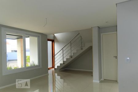 Sala de casa de condomínio à venda com 3 quartos, 140m² em Campo Novo, Porto Alegre