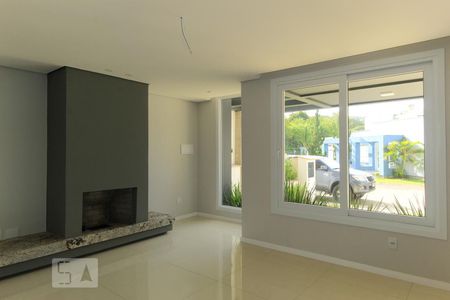 Sala de casa de condomínio à venda com 3 quartos, 140m² em Campo Novo, Porto Alegre