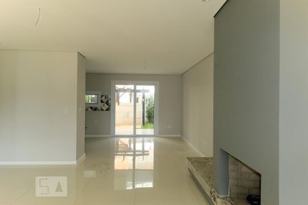 Sala de casa de condomínio à venda com 3 quartos, 140m² em Campo Novo, Porto Alegre