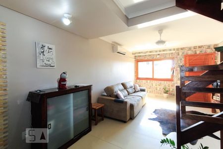 Sala de casa à venda com 3 quartos, 150m² em Guarujá, Porto Alegre