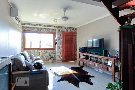 Sala de casa à venda com 3 quartos, 150m² em Guarujá, Porto Alegre