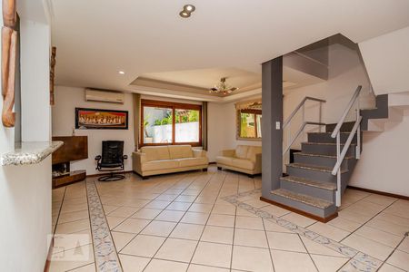 Sala de casa de condomínio à venda com 3 quartos, 300m² em Vila Nova, Porto Alegre