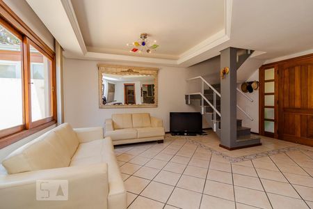 Sala de casa de condomínio à venda com 3 quartos, 300m² em Vila Nova, Porto Alegre