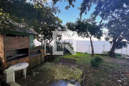 Casa de condomínio para alugar com 245m², 3 quartos e 2 vagasChurrasquiera com vista privilegiada para o Guaiba