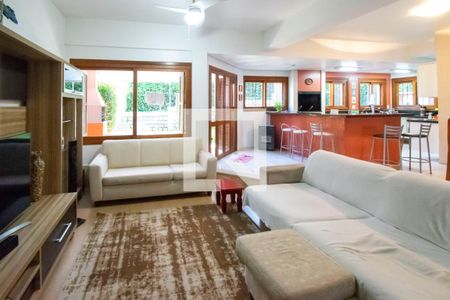 Sala de Estar de casa de condomínio à venda com 5 quartos, 284m² em Cavalhada, Porto Alegre