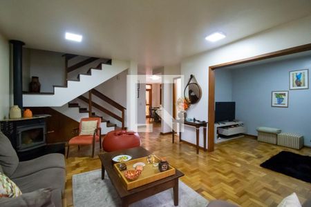 Sala de Estar de casa de condomínio à venda com 3 quartos, 150m² em Vila Nova, Porto Alegre