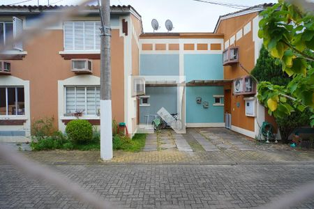 Sala - Vista de casa de condomínio à venda com 3 quartos, 86m² em Jardim Itu, Porto Alegre