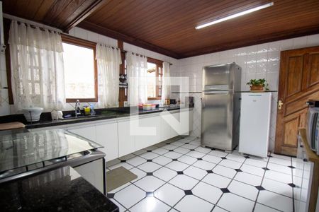 Casa de condomínio à venda com 460m², 4 quartos e 2 vagas Casa de condomínio à venda com 460m², 4 quartos e 2 vagasCozinha e Área de Serviço