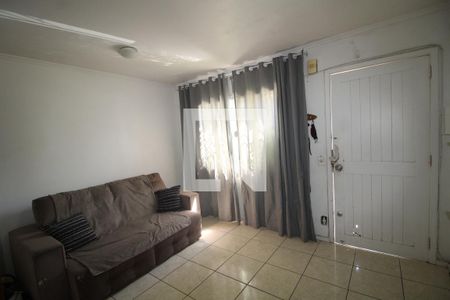 Sala de casa de condomínio à venda com 3 quartos, 102m² em Rio Branco, Canoas