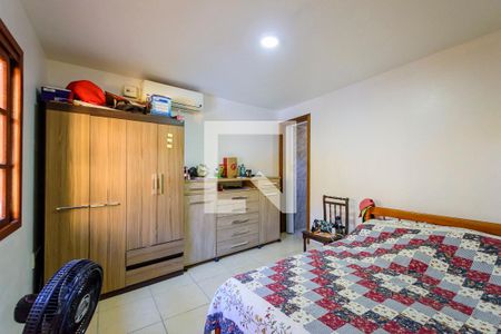 Suíte 2 de casa à venda com 4 quartos, 400m² em Campo Novo, Porto Alegre