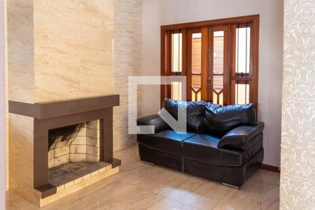 Sala com lareira de casa à venda com 3 quartos, 320m² em Rubem Berta, Porto Alegre